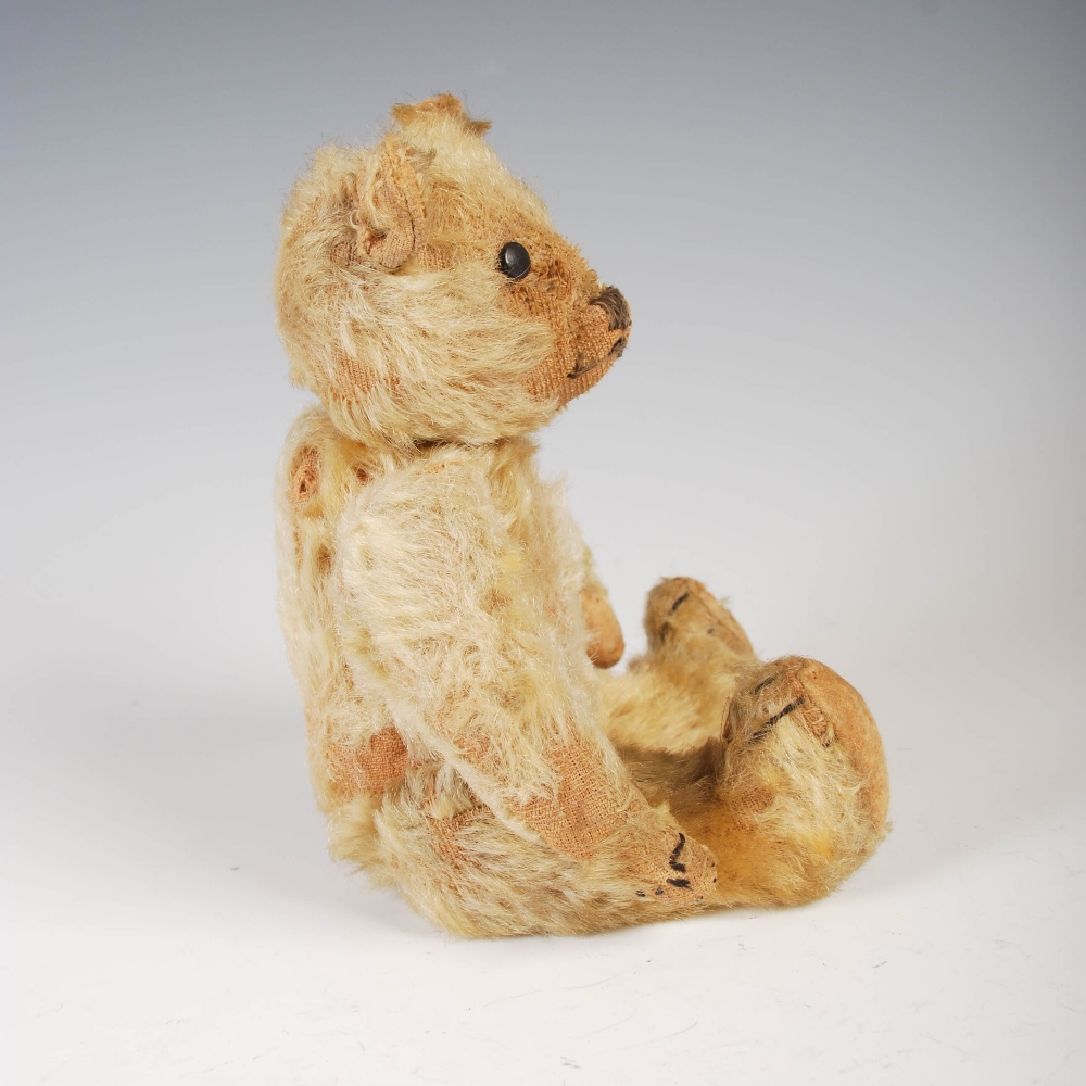 An early 20th century teddy bear, possibly Steiff, with golden mohair and brown/ black button boot - Image 3 of 10