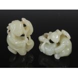 Two Chinese celadon jade figure groups, one carved and pierced with a girl and hare, 6cm high x
