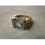 Gold blue topaz & diamond set ring