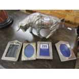 4 small silver plate photo frames and silver plate bull