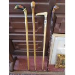 Collection of 4 walking sticks to include silver mounted