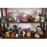 2 shelves of money boxes & collectables