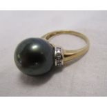 Gold black pearl & diamond set ring