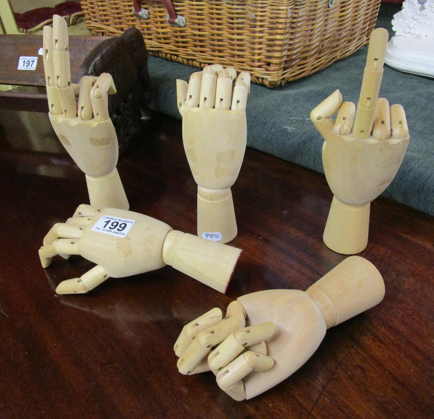 Collection of five articulated wooden artist's hands