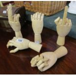 Collection of five articulated wooden artist's hands