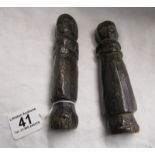 Early pair of carved furniture pegs with signs of original paint