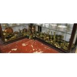 2 shelves of metalware, mostly brass to include early horse brasses