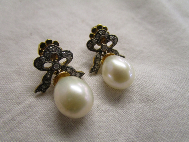 Pair of pearl and diamond earrings