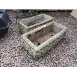 Pair of stone troughs adorned with acanthus leaves