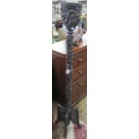 Early carved torch stand - H: 160cm