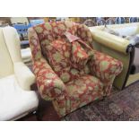 Upholstered wing-back floral armchair