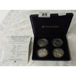 Four fine silver proof $50 coins