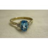 Gold blue topaz & diamond ring