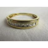 Gold channel set diamond ring