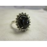 Fine star sapphire & diamond cluster ring