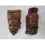 2 carved Oriental heads - H: 10cm