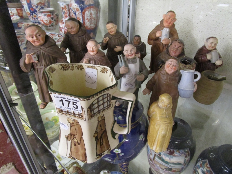 Collection of monk figures and monk themed jug