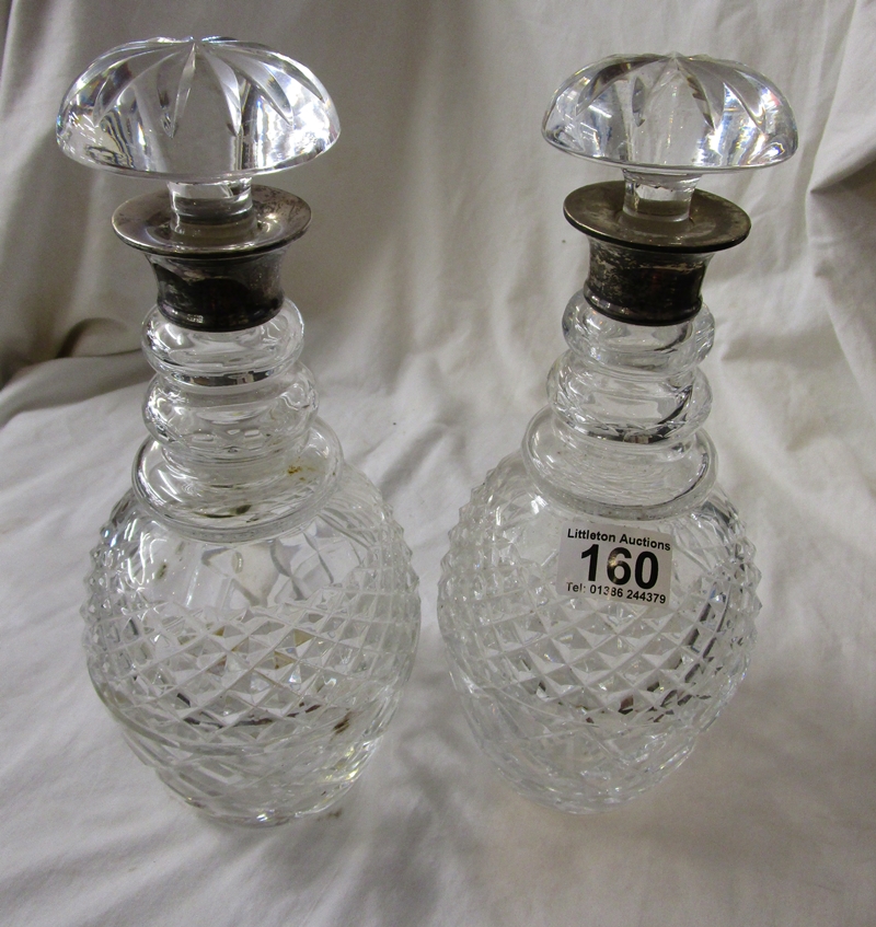 Pair of silver topped decanters