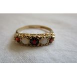 Gold garnet & opal set ring