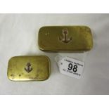 2 brass boxes adorned with anchors