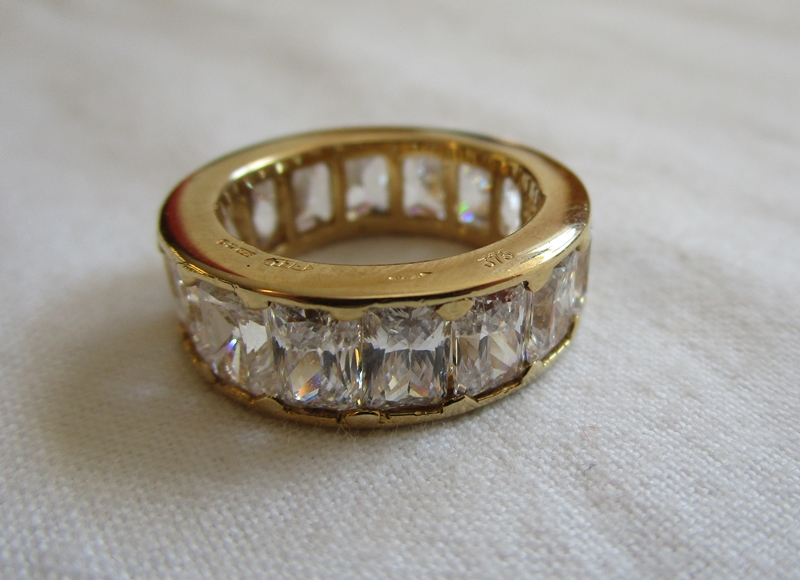 Heavy gold stone set full eternity ring