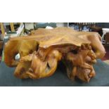 Heavy tree stump (possibly Mango) coffee table adorned with 6 finely carved horses (Diameter approx: