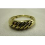 Gold channel set diamond ring