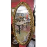 Large oval gilt framed mirror