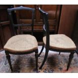 Pair of ebonised chairs