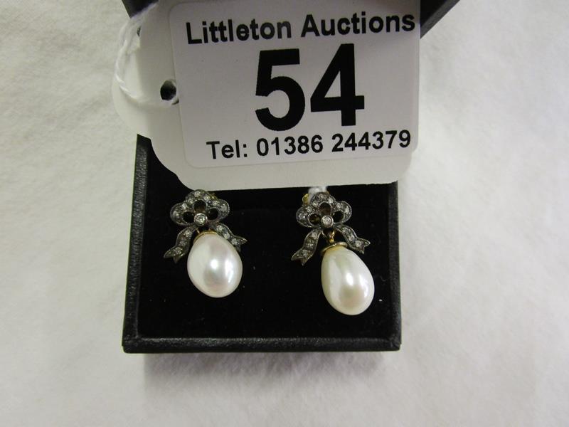 Pair of pearl & diamond earrings