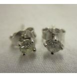 Pair of 18ct gold diamond stud earrings