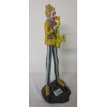 Clown figure playing saxophone