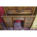 Edwardian oak desk on casters