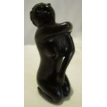 A Japanese hand carved Netsuke figure of a nude Geisha girl. Signed by the artist.