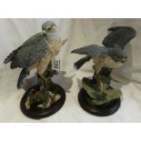 2 bird of prey figurines