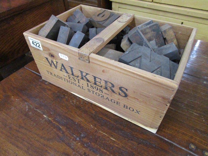 Advertising box full of printing block letters