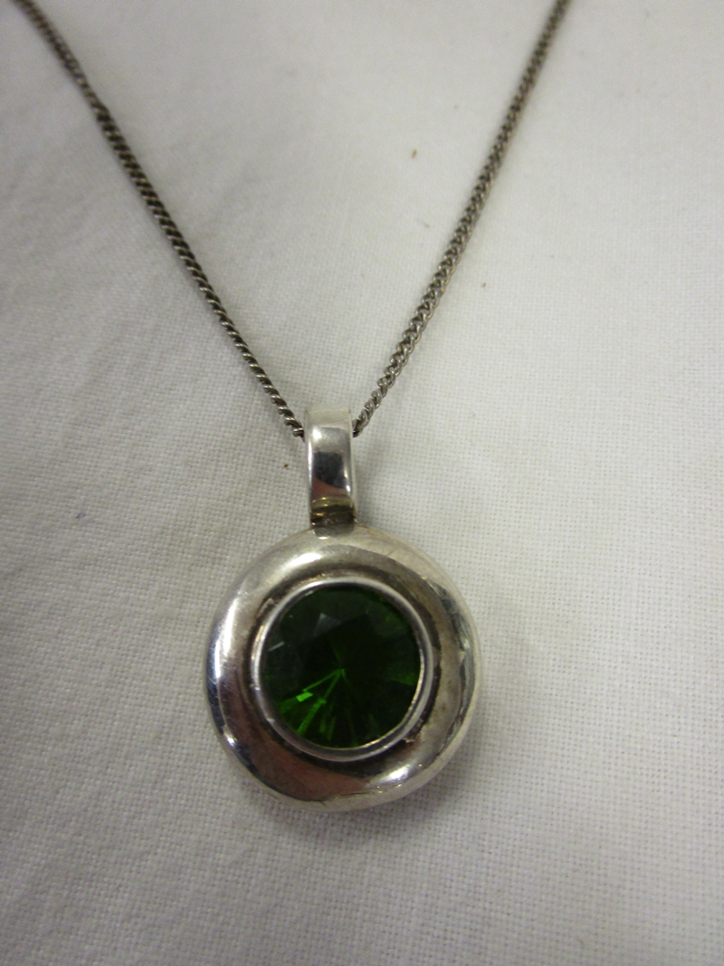 Silver peridot pendant on chain