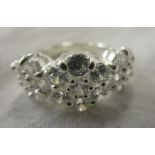 Silver triple cluster ring