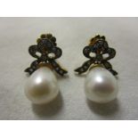 Pair of pearl and diamond bow earrings