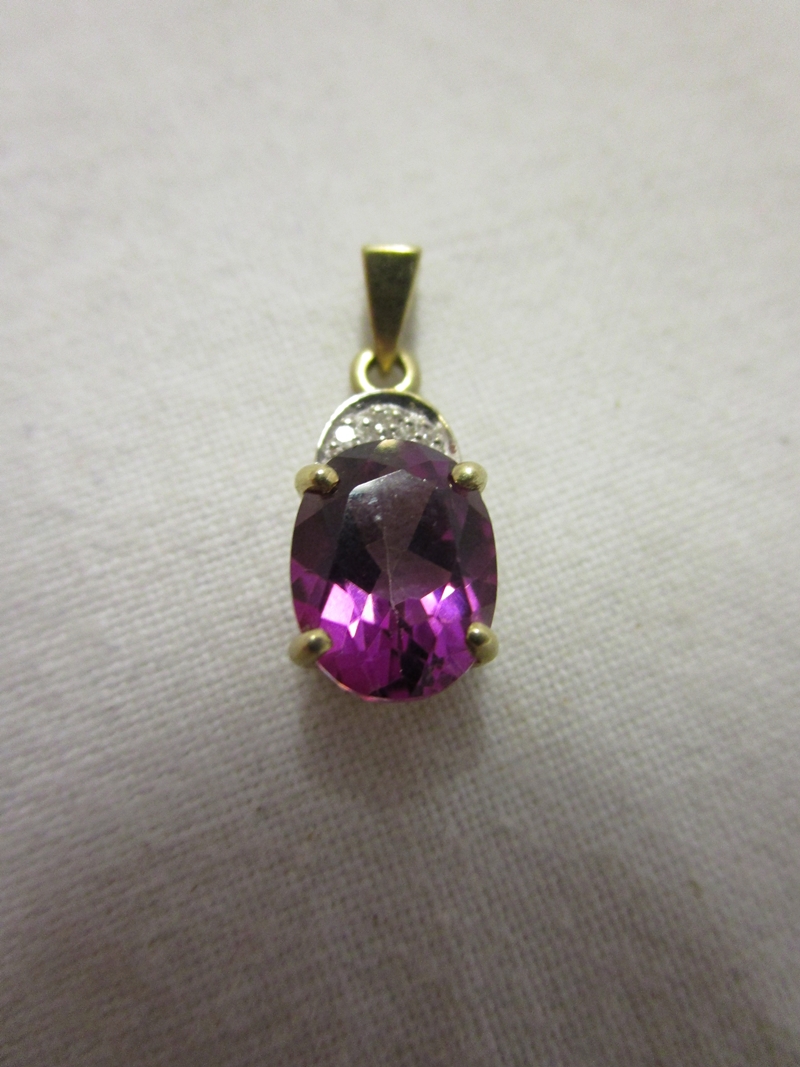 Gold amethyst and diamond pendant