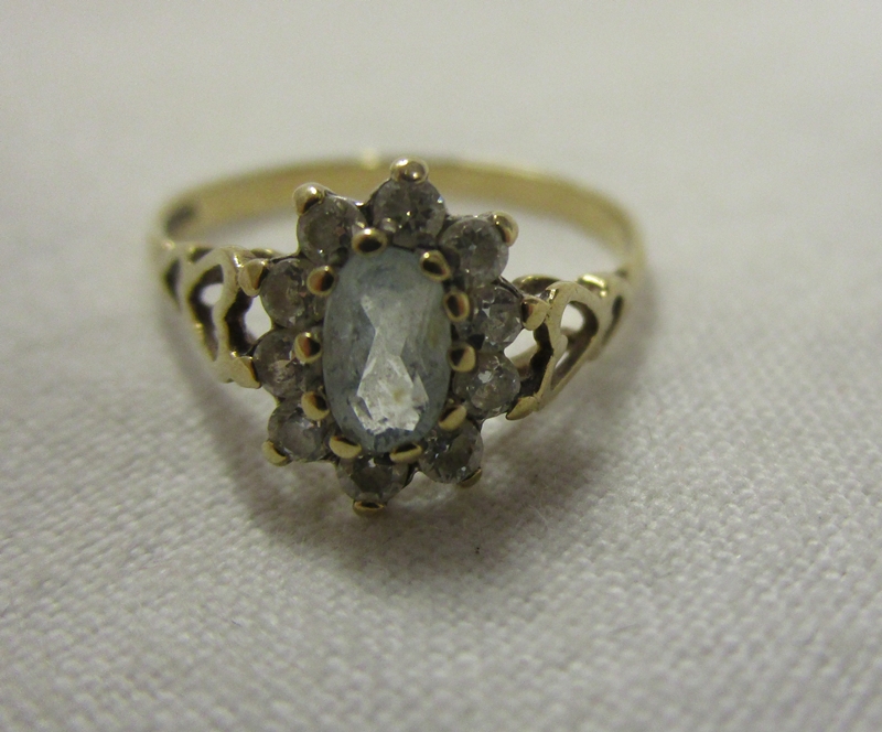 Gold stone set cluster ring