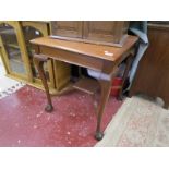 Square mahogany occasional table on ball and claw feet