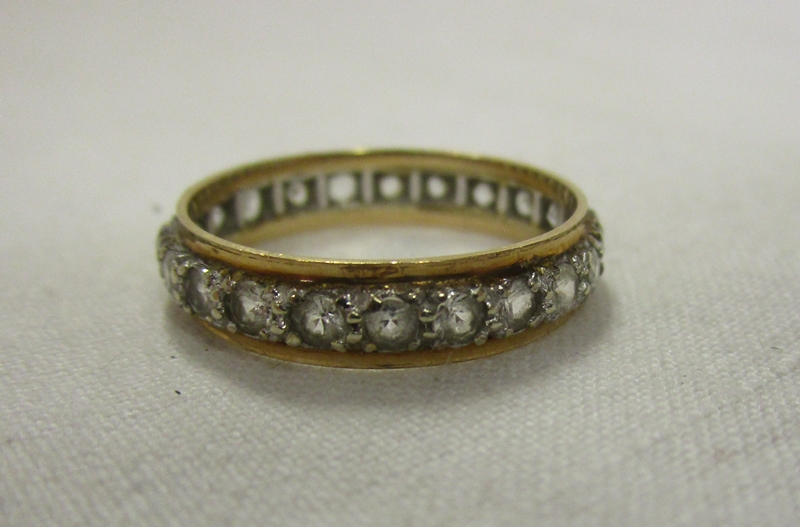 Gold stone set eternity ring