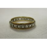 Gold stone set eternity ring