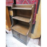 Ercol waterfall bookcase with cupboard