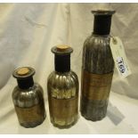 3 graduated display bottles