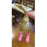 Carved duck in hunter wellies