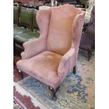 Wingback armchair on cabriole legs