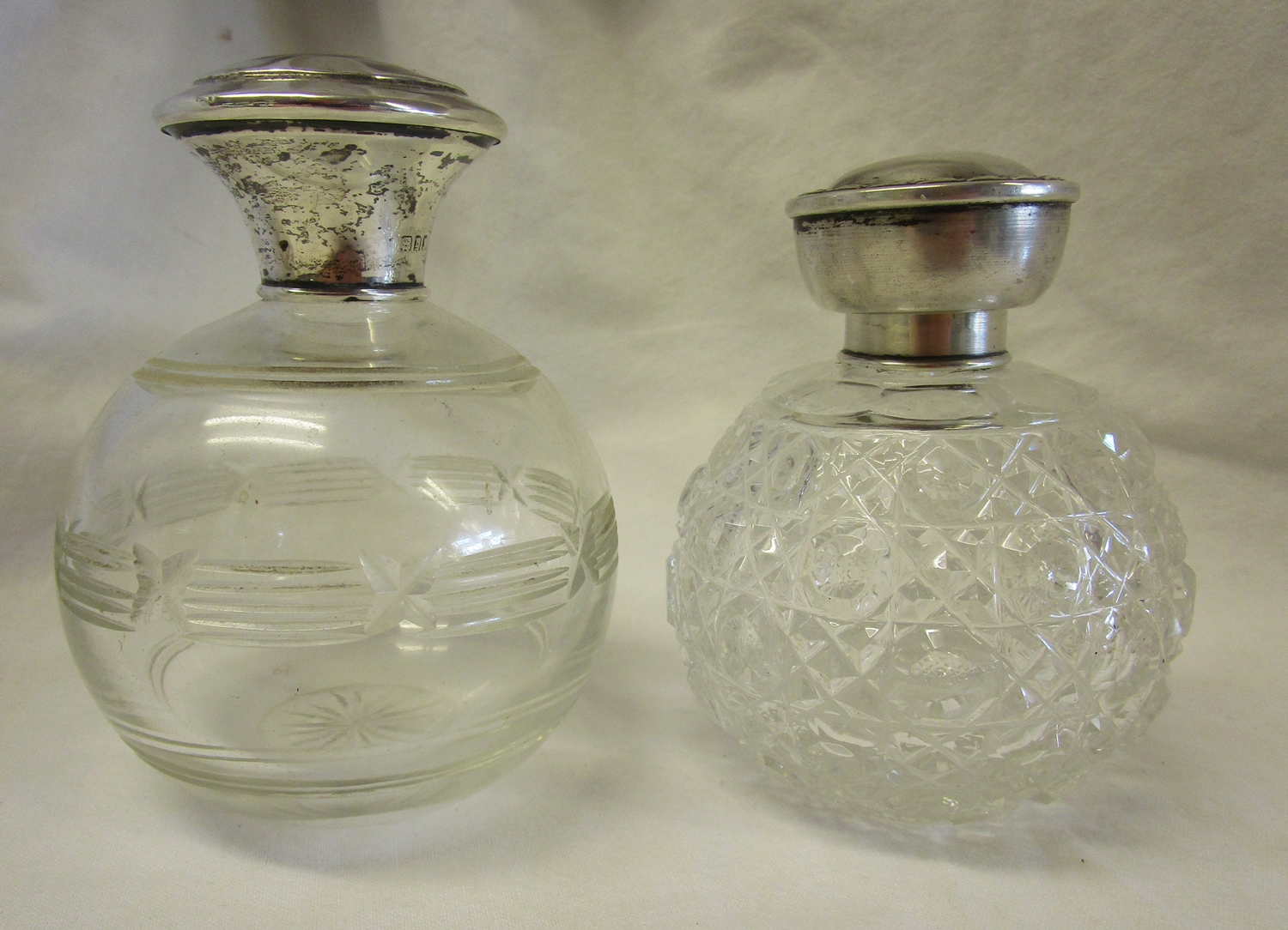 2 hallmarked silver topped perfume bottles