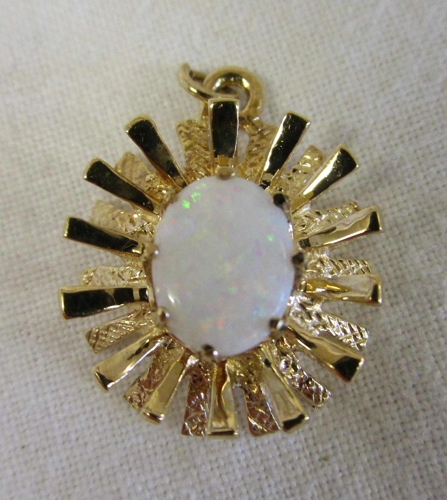 Gold opal set pendant